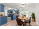 Charming eat-in kitchen featuring blue cabinets, a central island, and a cozy breakfast table at 111 Pine Grove Church Rd, Concord, NC 28025