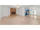 Open living area features a brick fireplace and flows into a kitchen with blue cabinets at 111 Pine Grove Church Rd, Concord, NC 28025