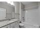Clean bathroom featuring granite countertop vanity and a shower-tub combination with white tile surround at 11227 Whimbrel Ct, Charlotte, NC 28278