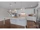 Spacious kitchen with a large island, pendant lighting, and stainless steel appliances at 11227 Whimbrel Ct, Charlotte, NC 28278