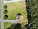 Aerial view of a home featuring a manicured lawn, trees, and long driveway at 1228 Swift Rd, Oakboro, NC 28129