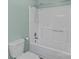 Clean, well-lit shower with detachable showerhead and a standard toilet at 1228 Swift Rd, Oakboro, NC 28129