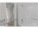 Bright bathroom with a tub-shower combination and modern gold fixtures at 1228 Swift Rd, Oakboro, NC 28129