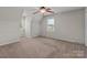 Inviting bedroom featuring neutral walls, carpet, ceiling fan, and large windows for ample natural light at 1228 Swift Rd, Oakboro, NC 28129