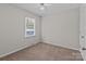 Bedroom with ceiling fan, carpet, and window at 1228 Swift Rd, Oakboro, NC 28129