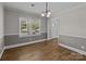 Dining room features wood floors, large windows and neutral walls at 1228 Swift Rd, Oakboro, NC 28129