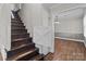 Inviting entry features wood stairs leading to an upper level with a charming decorative accent at 1228 Swift Rd, Oakboro, NC 28129
