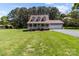 Beautiful exterior view of a home with a manicured lawn and attached garage at 1228 Swift Rd, Oakboro, NC 28129