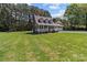 Exterior view of home with well-manicured lawn, garage, and dormer windows at 1228 Swift Rd, Oakboro, NC 28129