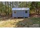 Backyard shed offering extra storage space in a private setting at 1228 Swift Rd, Oakboro, NC 28129
