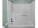 Clean, well-lit shower with detachable showerhead and built-in shelving at 1228 Swift Rd, Oakboro, NC 28129