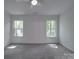 Bright bedroom features plush carpeting, two windows providing ample natural light and a ceiling fan at 1241 Pitts Rd, Chester, SC 29706