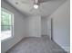 Bright bedroom with neutral carpet, ceiling fan and a window, providing a comfortable and inviting space at 1241 Pitts Rd, Chester, SC 29706