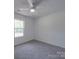 A bright bedroom with gray carpet and a clear window view at 1241 Pitts Rd, Chester, SC 29706
