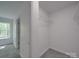Spacious walk-in closet boasts wire shelving, carpet flooring, and ample storage space at 1241 Pitts Rd, Chester, SC 29706