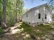Side and rear of home with an exterior painted with white siding at 1241 Pitts Rd, Chester, SC 29706