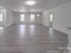Bright and spacious open-concept living room with access to front door and ceiling fan at 1241 Pitts Rd, Chester, SC 29706