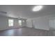 Open living room with light gray flooring, ceiling fan, and plenty of natural light at 1241 Pitts Rd, Chester, SC 29706