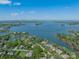 Beautiful aerial view of waterfront homes surrounded by lush greenery and sparkling blue waters at 125 Swayne Dr, Mooresville, NC 28117