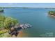 Scenic aerial view of waterfront property with a private boat dock at 125 Swayne Dr, Mooresville, NC 28117
