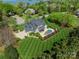 Aerial view showcasing the home's private backyard pool with manicured lawn and landscaping at 125 Swayne Dr, Mooresville, NC 28117
