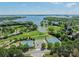 Beautiful aerial view of community amenities including tennis courts, pond, and golf course at 125 Swayne Dr, Mooresville, NC 28117