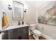 Modern half bathroom with stylish vanity, contemporary lighting, and hardwood floors at 125 Swayne Dr, Mooresville, NC 28117