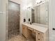 Bathroom with a walk-in shower and a vanity with a mirror at 125 Swayne Dr, Mooresville, NC 28117