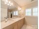 Bright bathroom with double sinks, natural light, and tiled floors at 125 Swayne Dr, Mooresville, NC 28117