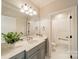 Bathroom featuring a vanity with a sink, a large mirror, and modern fixtures at 125 Swayne Dr, Mooresville, NC 28117