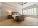 Spacious bedroom with plush carpet, a ceiling fan, and plenty of natural light at 125 Swayne Dr, Mooresville, NC 28117