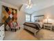Bedroom featuring a unique accent wall, a bed with storage, and a ceiling fan at 125 Swayne Dr, Mooresville, NC 28117