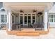 Covered patio area has two ceiling fans and seating at 125 Swayne Dr, Mooresville, NC 28117