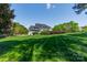Inviting two-story home featuring pristine lawn and lush landscaping at 125 Swayne Dr, Mooresville, NC 28117