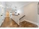 Bright hallway with hardwood floors and a modern chandelier at 125 Swayne Dr, Mooresville, NC 28117
