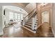 Elegant staircase leading to a spacious living area with natural light at 125 Swayne Dr, Mooresville, NC 28117