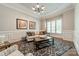 Cozy living room with decorative rug, wainscoting, and plantation shutters at 125 Swayne Dr, Mooresville, NC 28117