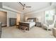 Comfortable main bedroom with neutral tones, carpet, and a ceiling fan at 125 Swayne Dr, Mooresville, NC 28117
