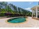 Scenic backyard swimming pool with water feature, lush landscaping and beautiful patio at 125 Swayne Dr, Mooresville, NC 28117