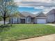 Charming single-story home with landscaped lawn, blue shutters, and attached garage at 126 Dairy Farm Rd, Mooresville, NC 28115