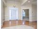 Spacious foyer featuring hardwood floors, neutral walls, chandelier, and access to other rooms at 126 Dairy Farm Rd, Mooresville, NC 28115