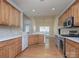 Well-equipped kitchen featuring stainless steel appliances, wood cabinets, and an open dining area at 126 Dairy Farm Rd, Mooresville, NC 28115
