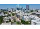 Aerial view showcasing modern townhomes with Charlotte skyline backdrop and residential neighborhood at 1416 S Church St, Charlotte, NC 28203