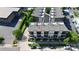 Aerial view of townhouses with balconies and parking, nestled among trees, showcasing a residential community at 1416 S Church St, Charlotte, NC 28203