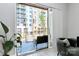 View from indoor living space to outdoor balcony featuring seating area and urban environment at 1416 S Church St, Charlotte, NC 28203