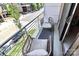 Balcony with wicker chairs and pillows overlooking the street, creating a cozy outdoor space at 1416 S Church St, Charlotte, NC 28203