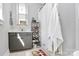 Cozy bathroom features a shower with a curtain, a vanity sink, and storage shelves at 1416 S Church St, Charlotte, NC 28203