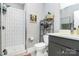 Stylish bathroom with modern shower, sleek vanity, and decorative shelving for toiletries at 1416 S Church St, Charlotte, NC 28203