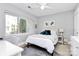 Bright bedroom featuring a ceiling fan, large window, and cozy decor for a comfortable and inviting atmosphere at 1416 S Church St, Charlotte, NC 28203