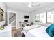 Well-lit bedroom includes a ceiling fan, large window, and a desk space with a TV for work or entertainment at 1416 S Church St, Charlotte, NC 28203